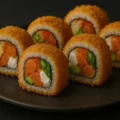 Crunchy Crazy Maki Kani kama, salmon, avocado, asparagus, cream cheese, masago bredded & deep fry.